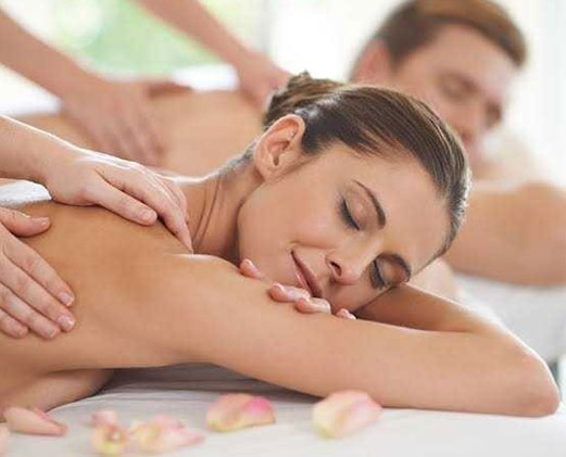 female and male client both are enjoying relaxing massage